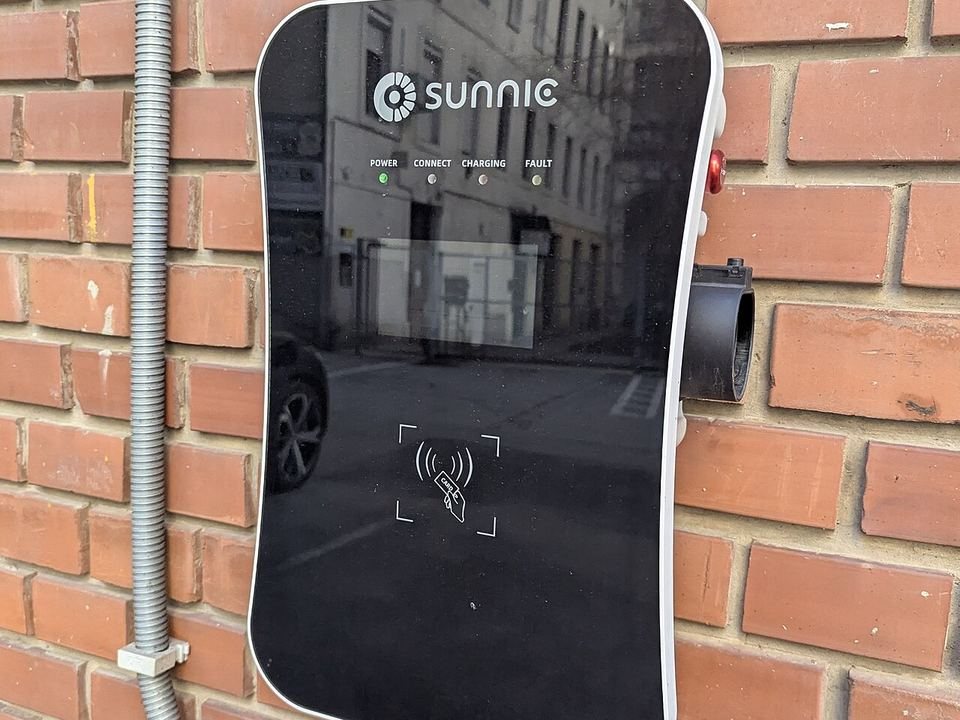Wallbox with RFID reader mounted on a brick wall